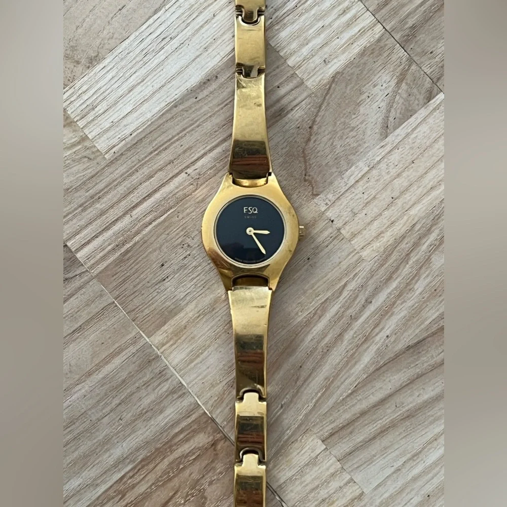 ESQ by Movado Ladies Watch Black Dial Gold Tone Bracelet and Hands